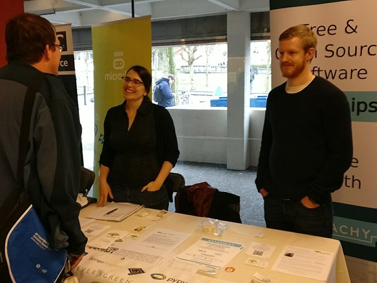 Photo of Karen Sandler and Mike McQuaid at Conservancy's FOSDEM booth