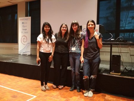 Photo of Karen with Outreachy alums at DebConf