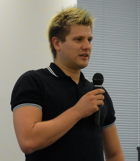 Photo of Christoph Hellwig speaking at DebConf 2015