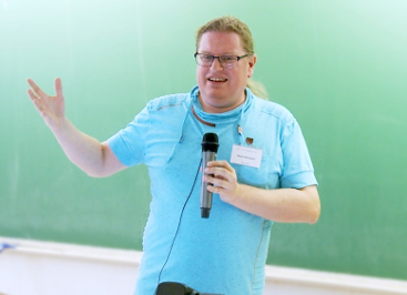 Mark Wielaard addressing a group in front of a chalkboard