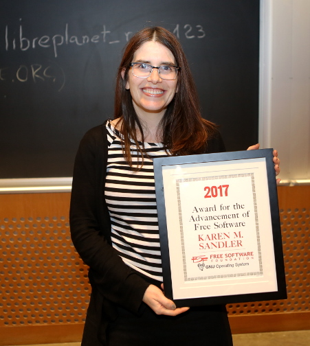 Karen Sandler poses with her 2017 Award for the Advancement of Free Software