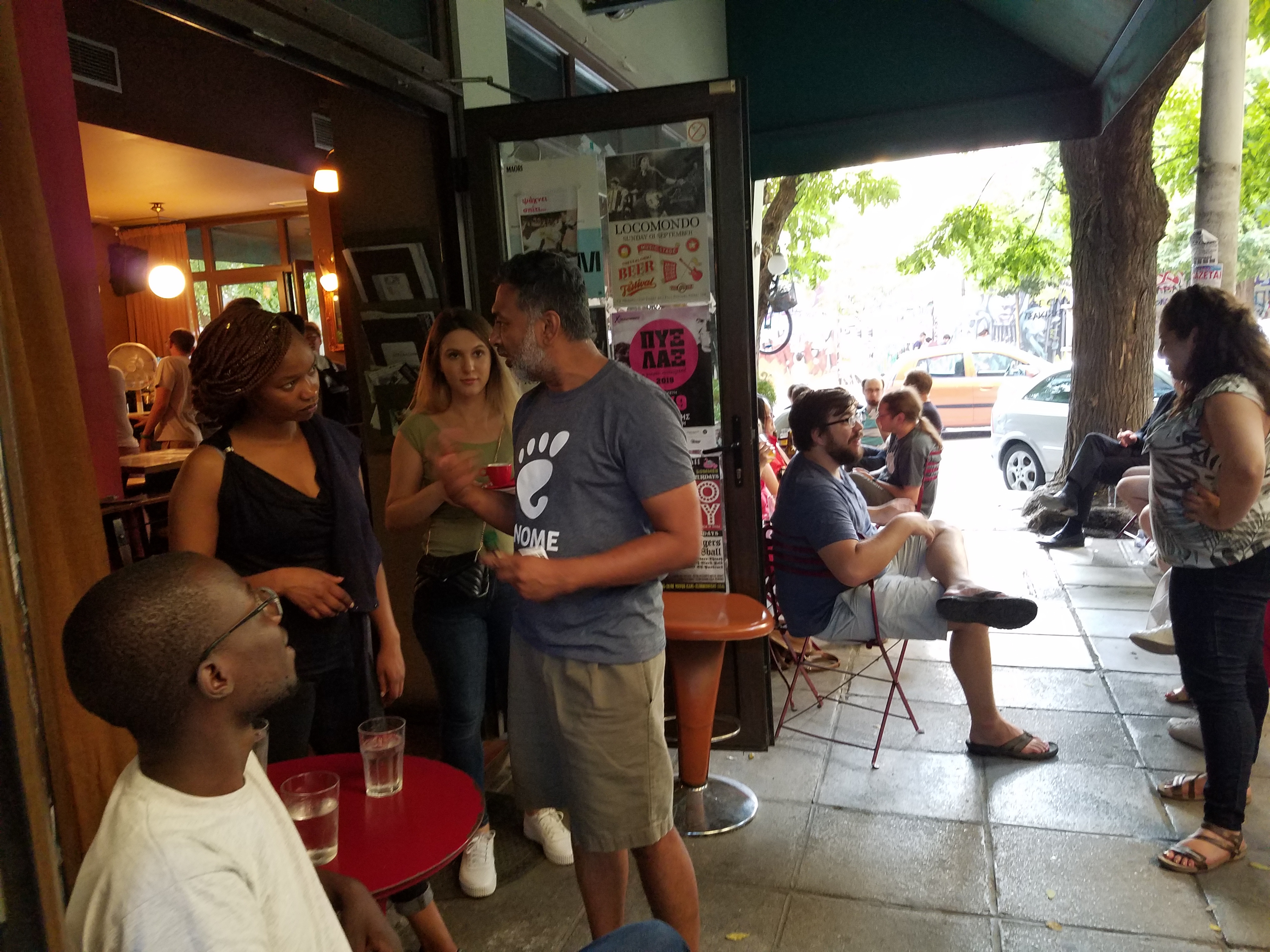 Various people sitting around at an outdoor cafe